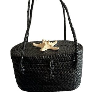 Get ready for summer with this mini straw bag and shell on top.